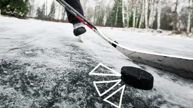 Photo of puck on outdoor ice with illustrations laid over
